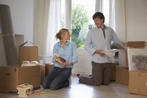 Packed office furniture and crates ready for a Croydon commercial move