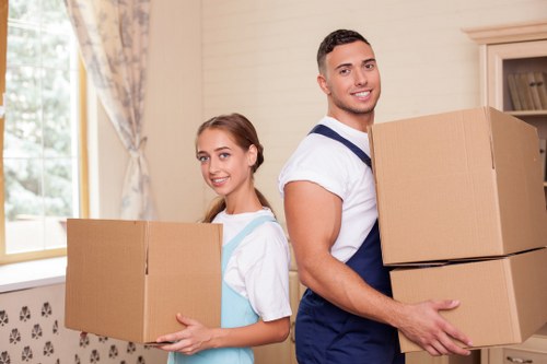 Packed moving boxes and furniture ready for transport